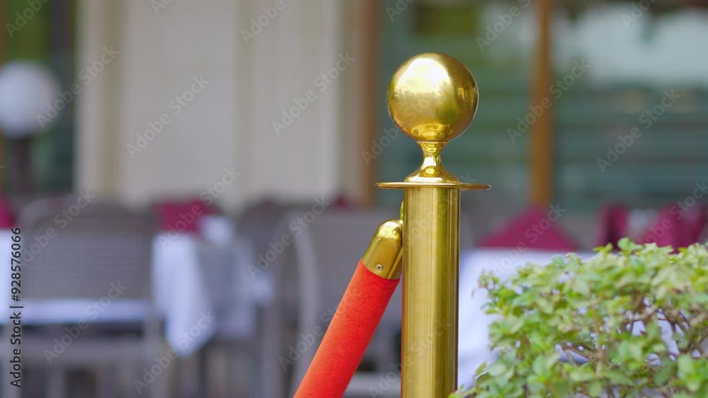 Red velvet rope and golden posts on a luxury walkway in 4k slow motion 60fps Red velvet rope and golden posts on a luxury walkway in 4k slow motion 60fps