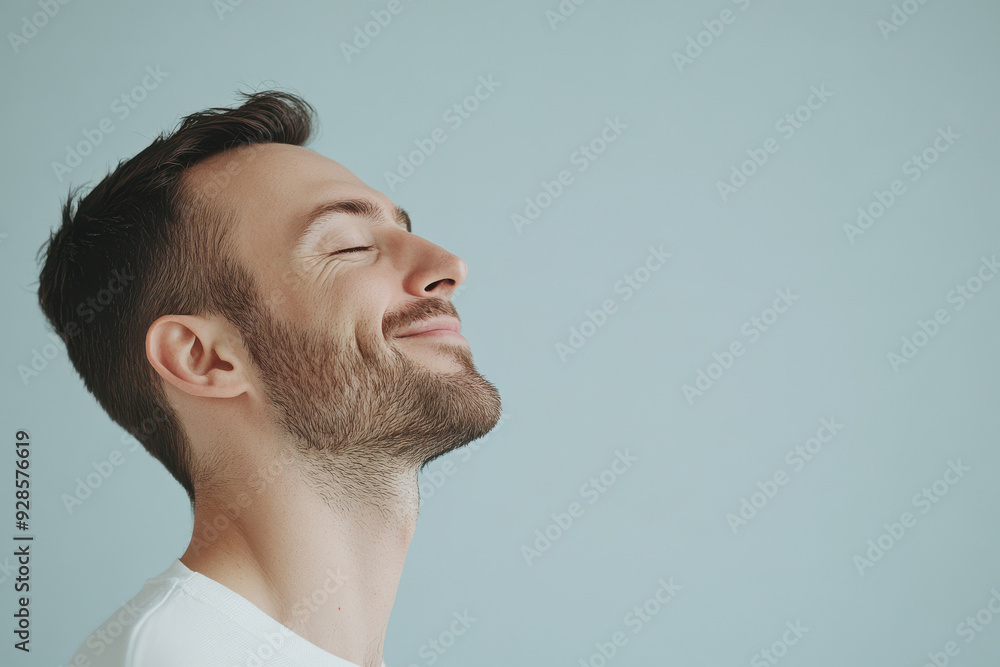 Obraz premium A close up of a man's face with his eyes closed