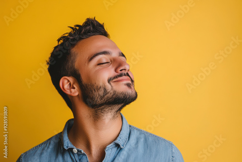 A close up of a man's face with his eyes closed