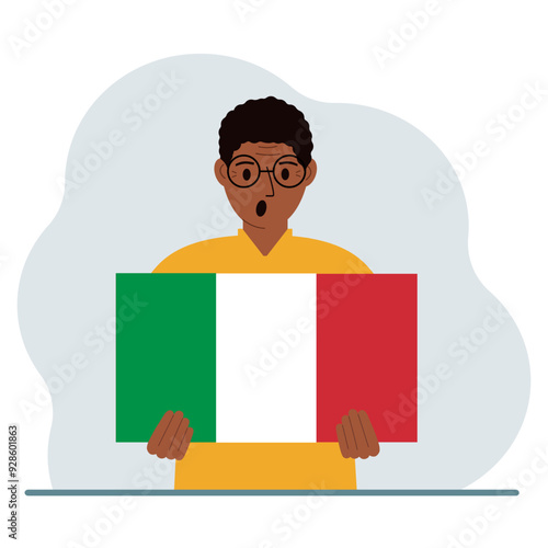 A man holds an Italian flag in his hands. The concept of demonstration, national holiday or patriotism.