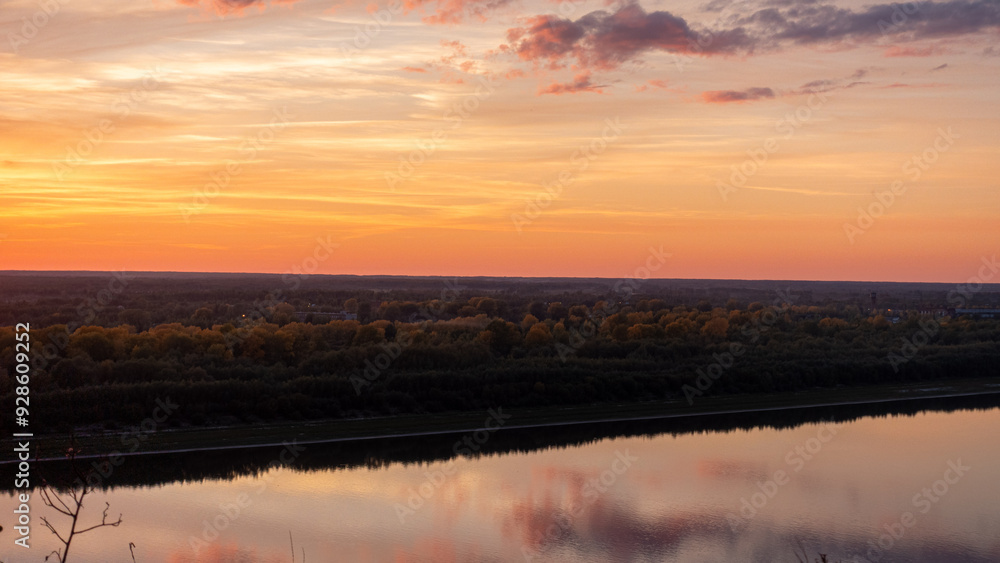 Fototapeta premium Tranquil Sunset Reflections over Calm River