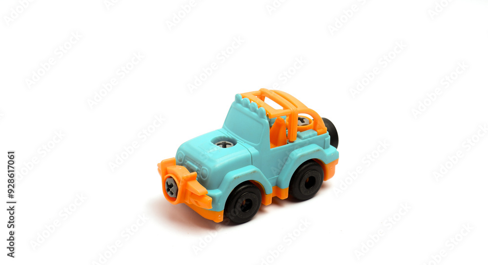 Children's Toy Cars Made Of Turquoise And Orange Plastic, With An Isolated White Background And Rule Of Thirds Photo Composition Children's Toy Cars Made Of Turquoise And Orange Plastic, With An Isolated White Background And Rule Of Thirds Photo Composition