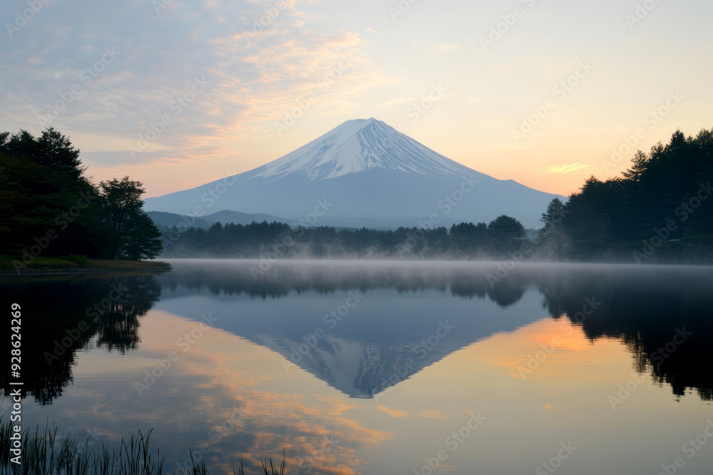 A stunning sunrise view of Mount Fuji reflected in a calm lake, with soft morning light illuminating the scene. Perfect for travel and nature photography. A stunning sunrise view of Mount Fuji reflected in a calm lake, with soft morning light illuminating the scene. Perfect for travel and nature photography.