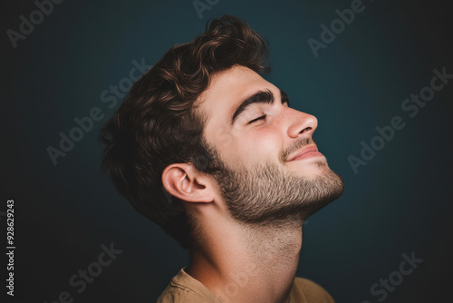 A close up of a man's face with his eyes closed