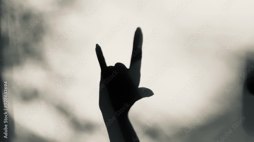 hand shadow on the wall, rock sign hand shadow on the wall, rock sign