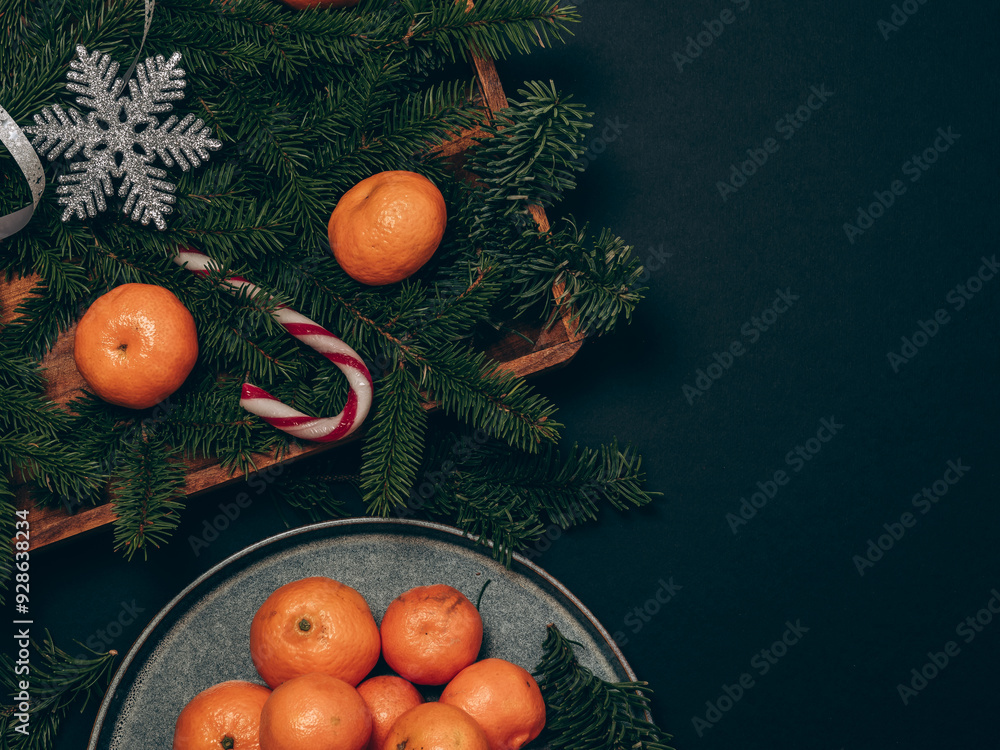 Christmas card with tangerines. Plate with tangerines with Christmas decorations Christmas card with tangerines. Plate with tangerines with Christmas decorations