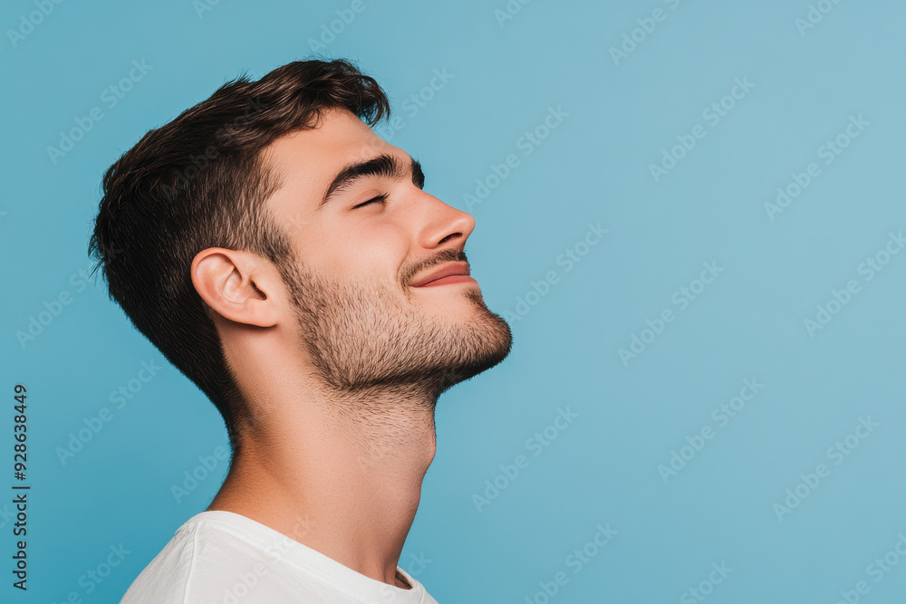 Obraz premium A close up of a man's face with his eyes closed
