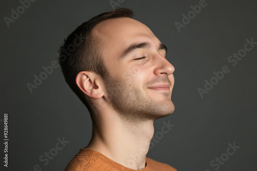 A close up of a man's face with his eyes closed