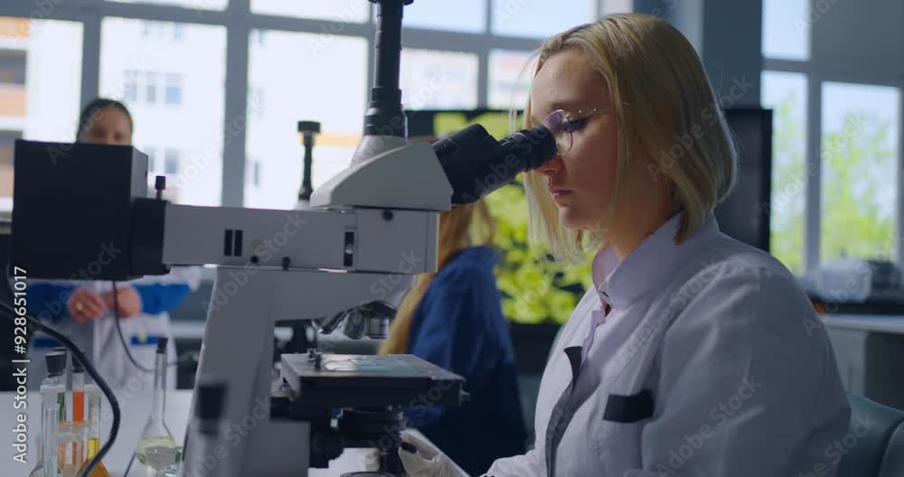 Smart School Student Girl Looking Through Microscope In Chemistry Classroom, Portrait In School Smart School Student Girl Looking Through Microscope In Chemistry Classroom, Portrait In School