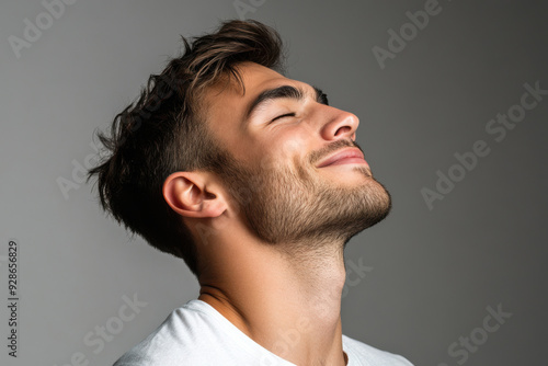 A close up of a man's face with his eyes closed