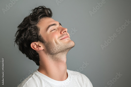 A close up of a man's face with his eyes closed