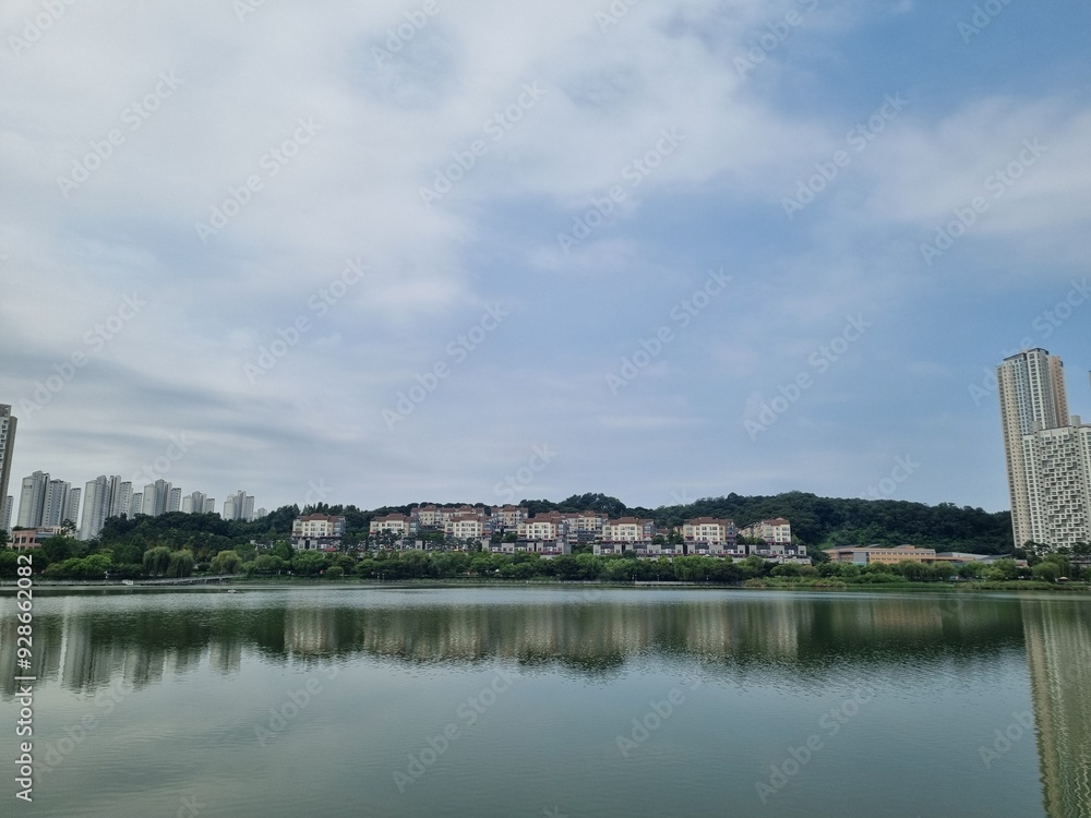 Naklejka premium Buildings reflected on the river 