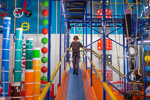 happy boy on a sports hill in a training hall. Active family recreation photo