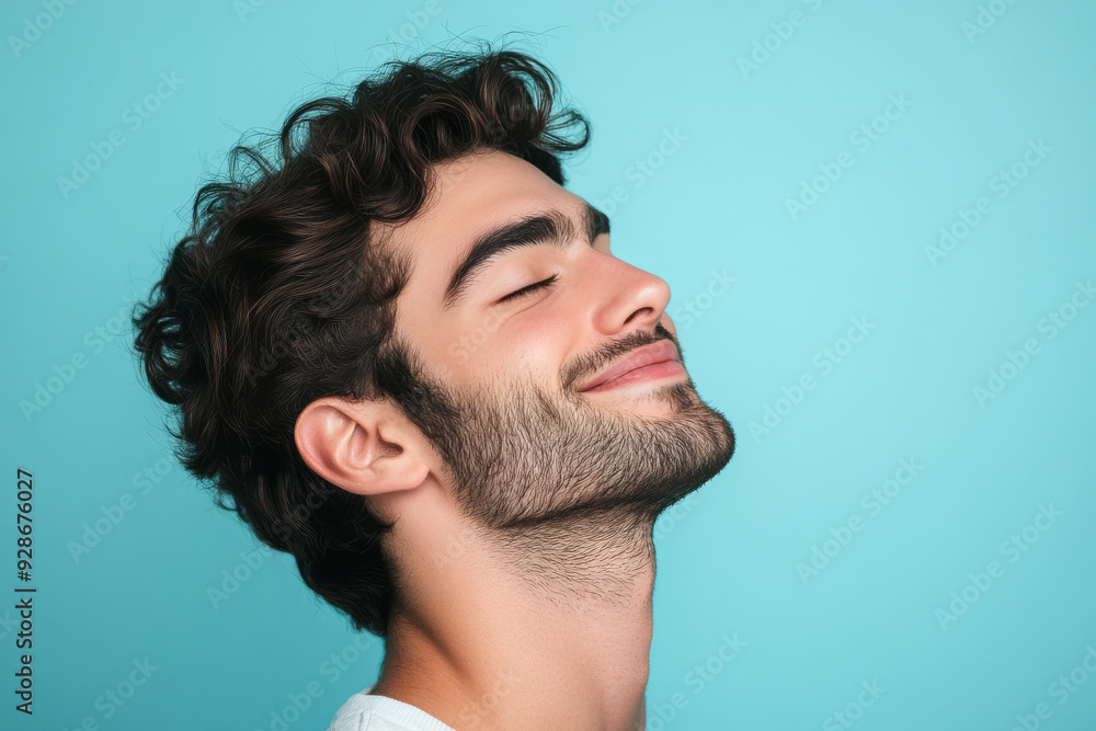 Obraz premium A close up of a man's face with his eyes closed