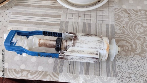 Old toilet flush system on table