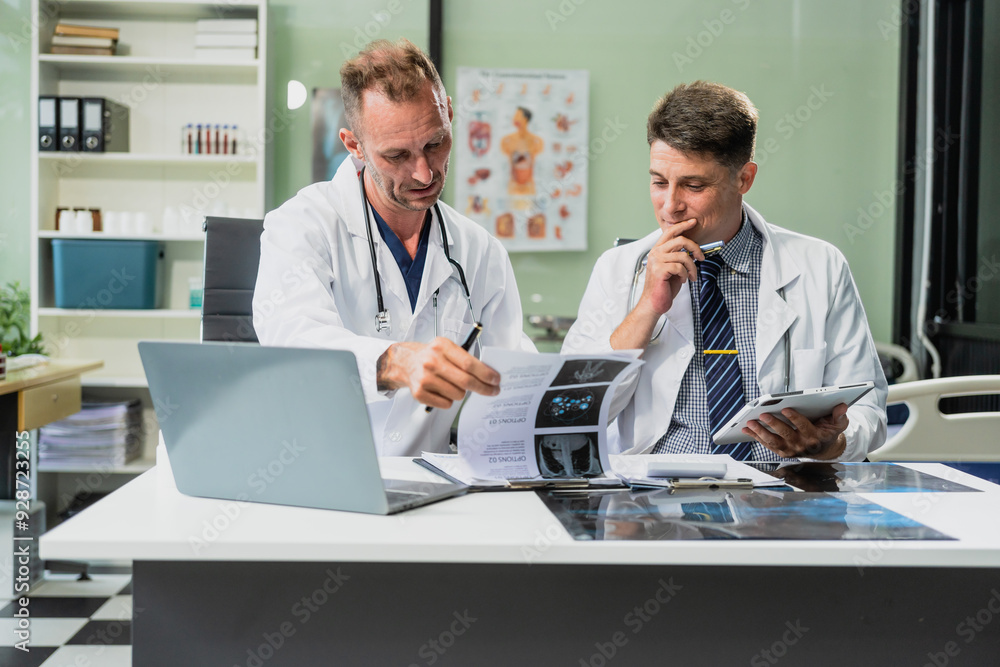Obraz premium Caucasian middle-aged male doctor and Italian scientific researcher are seated at desk, discussing innovative antiviral drug inventions, with a monitor displaying the latest technology advancements.