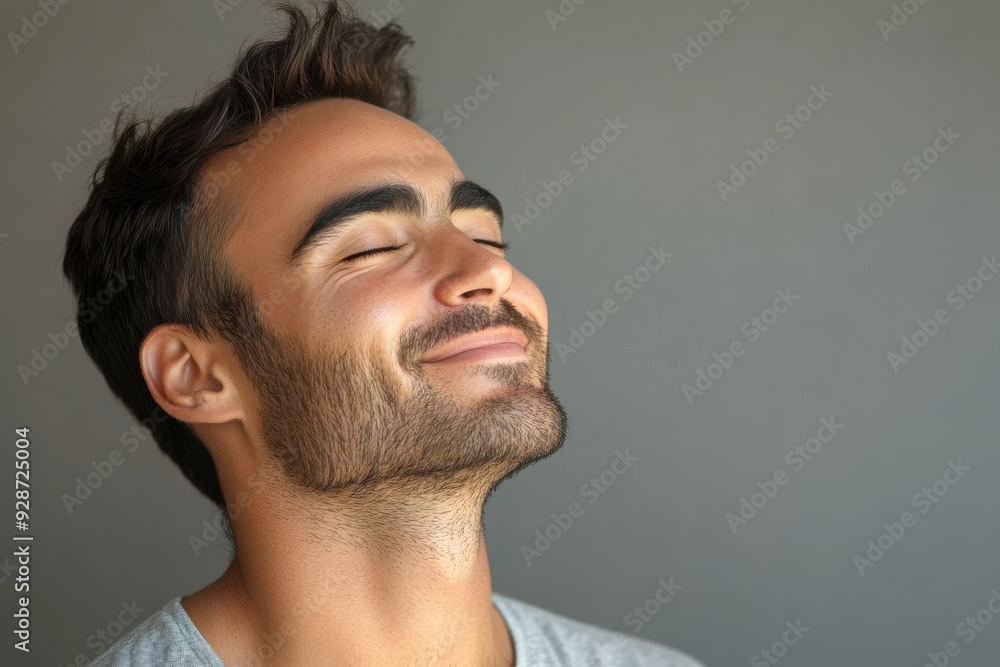 Fototapeta premium A close up of a man's face with his eyes closed