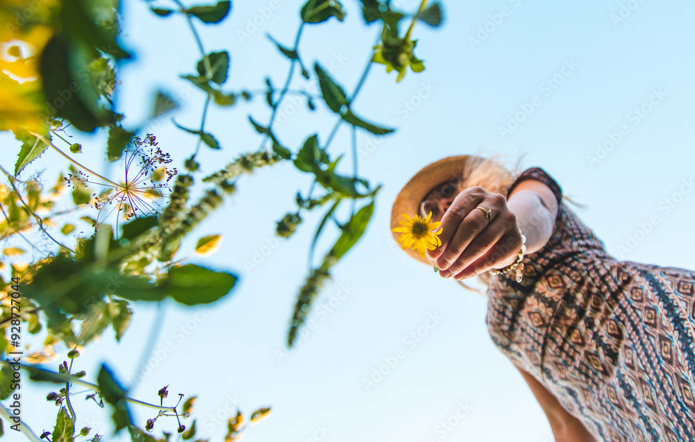 Obraz premium Woman in the park with flowers summer. Selective focus.