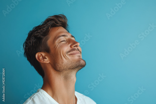 A close up of a man's face with his eyes closed