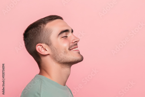 A close up of a man's face with his eyes closed