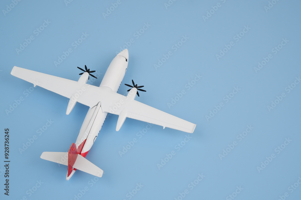 Airplane model on blue background. Copy space for text. Airplane model on blue background. Copy space for text.