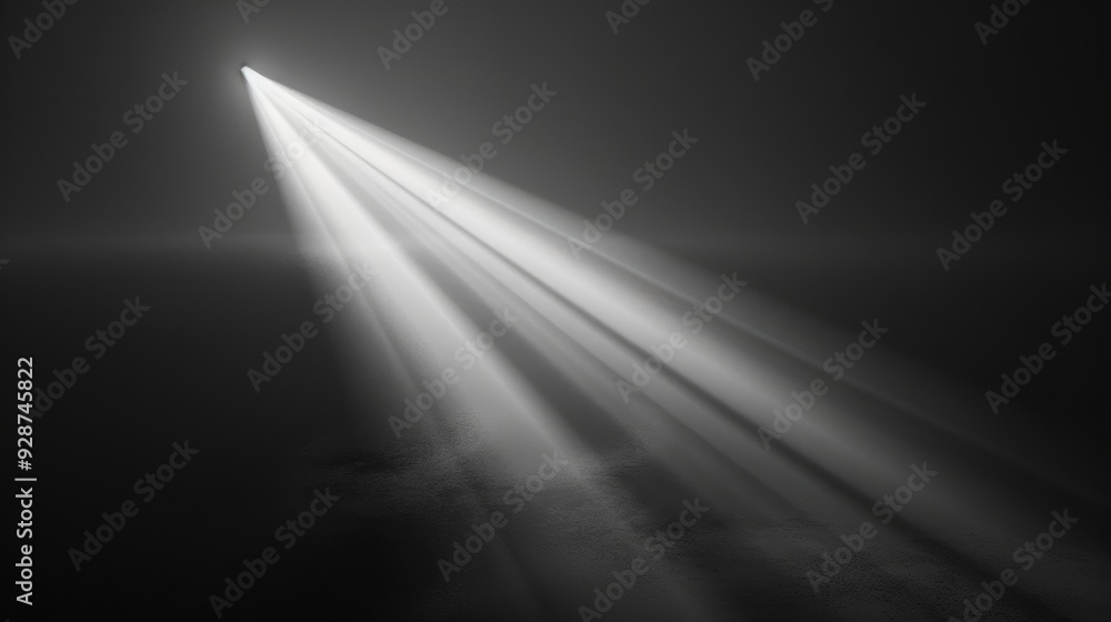 A single spotlight shines in a dark room. A single spotlight shines in a dark room.