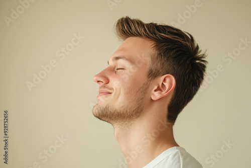 A close up of a man's face with his eyes closed