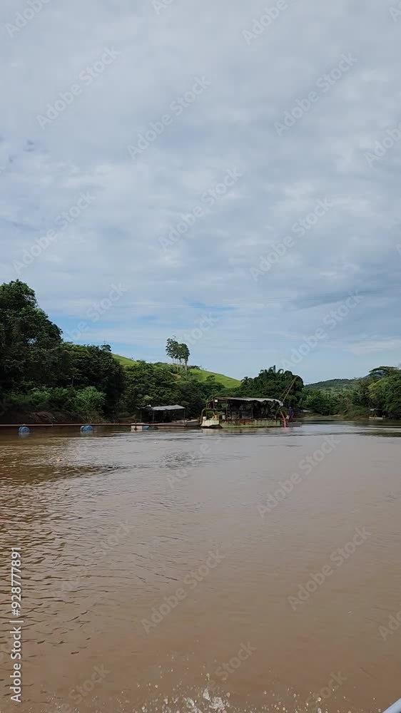 Boating on the Paraíba do Sul River, Rio de Janeiro's main water supply and threatened by environmental problems such as urban growth and pollution Boating on the Paraíba do Sul River, Rio de Janeiro's main water supply and threatened by environmental problems such as urban growth and pollution