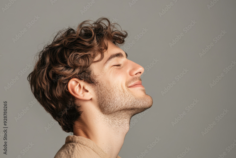 Obraz premium A close up of a man's face with his eyes closed