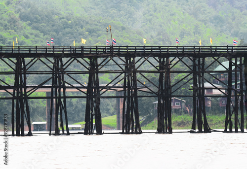 Beautiful landscape, Mon Bridge or Umanmanat wooden bridge. The longest wooden bridge in Thailand At Sangkhla Buri photo