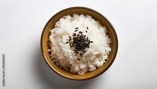 On a white BackgroundTop view of a bowl of rice with black seeds photo