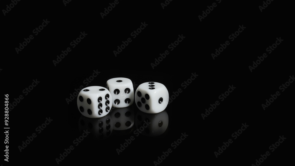 A set of three white dice next to each other on a black background A set of three white dice next to each other on a black background