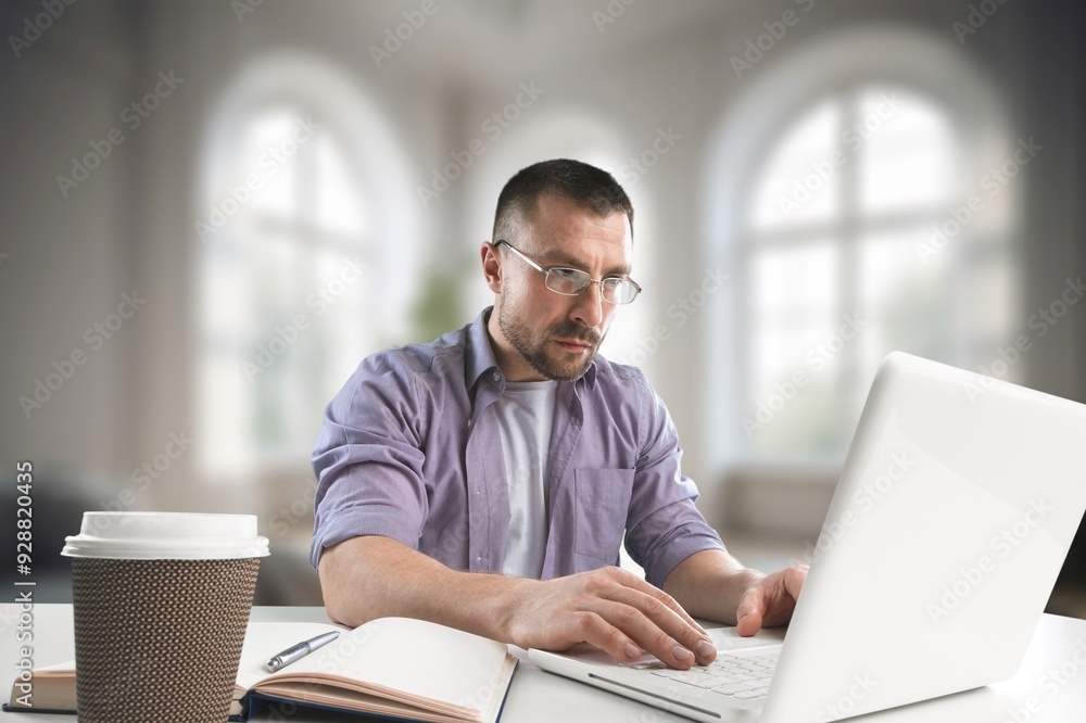 Happy teenager guy studying with laptop computer Happy teenager guy studying with laptop computer