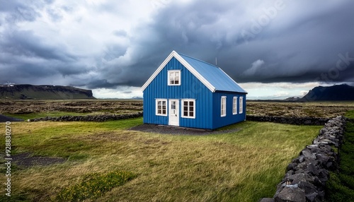 Blue House Under Cloudy Sky in Iceland