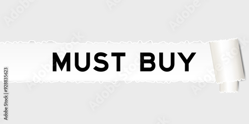 Ripped gray paper background that have word must buy under torn part