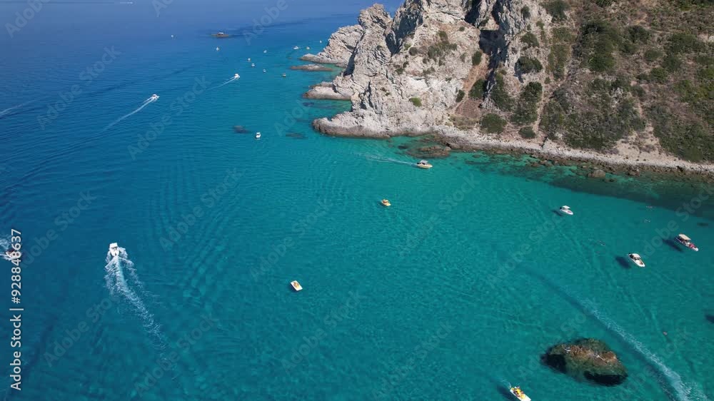 A perfect summer moment that makes you want to dive into the sea or go boating. Crystal clear water through which you can see the bottom. Colourful boats stand out against the sea. A perfect summer moment that makes you want to dive into the sea or go boating. Crystal clear water through which you can see the bottom. Colourful boats stand out against the sea.