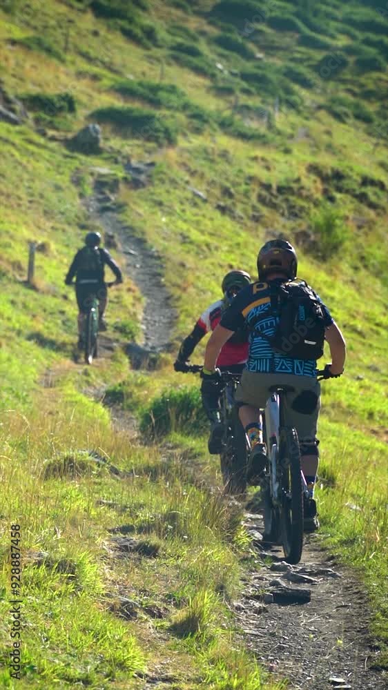 Slow motion. People cycling on mountain bikes in nature. Slow motion. People cycling on mountain bikes in nature.