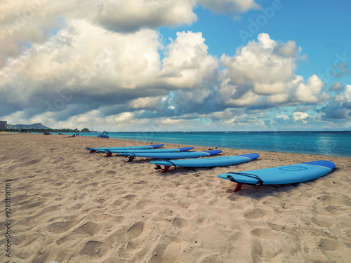 A sunny say at the ala moana beach and spotting a view surf boards photo