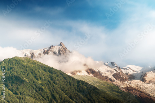 Scenic View Of Clouds Moving Over Alps Mountain Tops On A Sunny Day in Chamonix, France