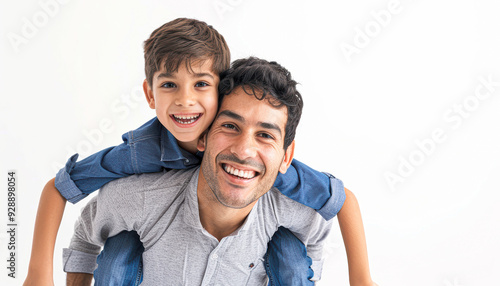 A man and a boy are smiling and hugging each other