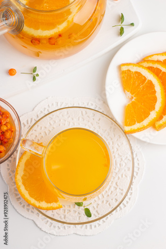 Sea buckthorn tea drink with oranges and mint. Autumn comfort hot drink. Herbal vitamin tea. 