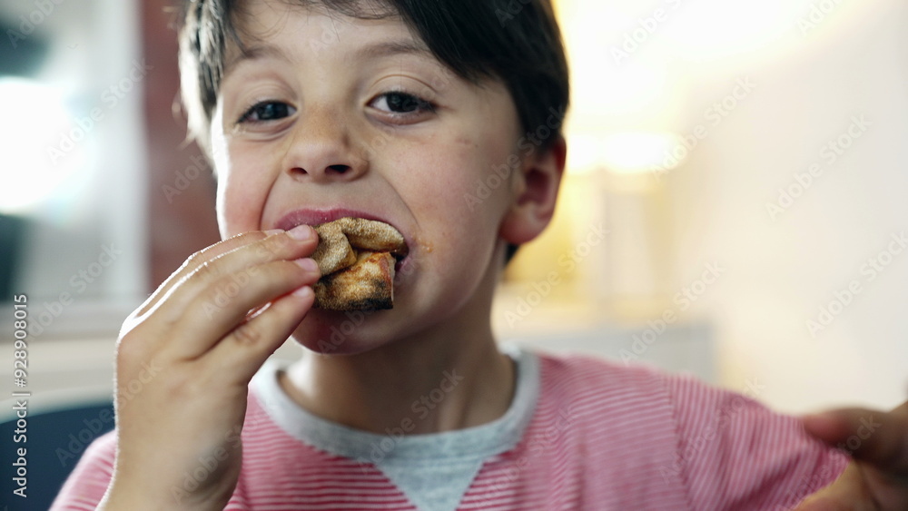 Child making a funny face while eating pizza, capturing a playful and spontaneous moment during a meal. joy and liveliness of a child enjoying his food Child making a funny face while eating pizza, capturing a playful and spontaneous moment during a meal. joy and liveliness of a child enjoying his food