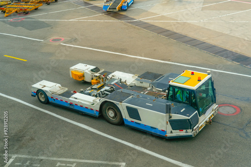 Tow truck vehicles trailer for puch back plane at the airfield.