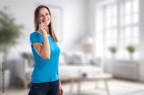 Shot of smiling happy young woman using mobile phone Free Download Shot of smiling happy young woman using mobile phone - GFXLoad