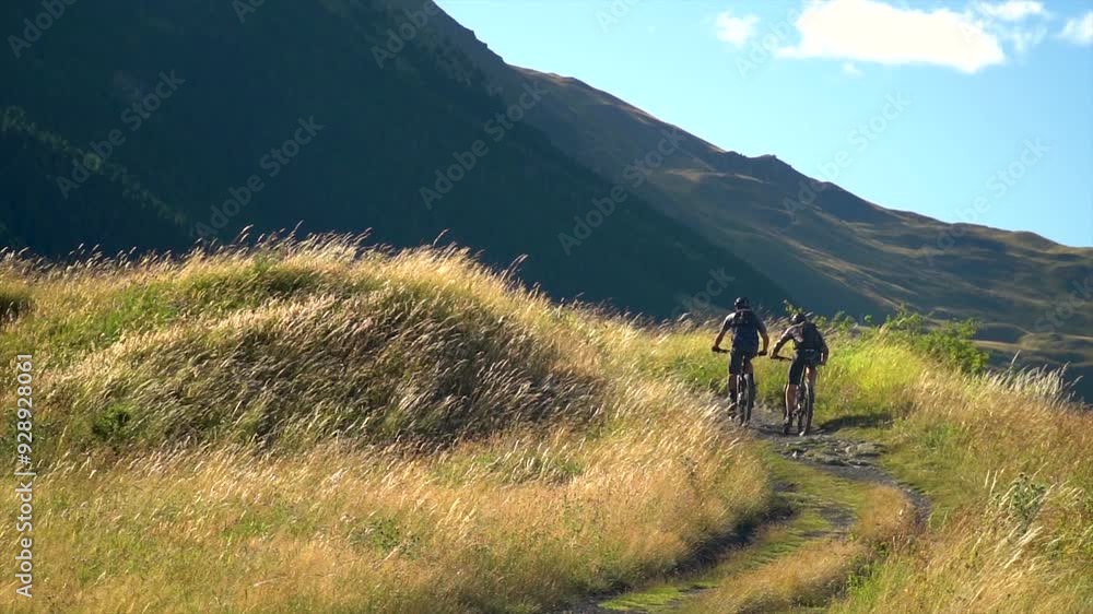 Slow motion. People cycling on mountain bikes in nature. Slow motion. People cycling on mountain bikes in nature.