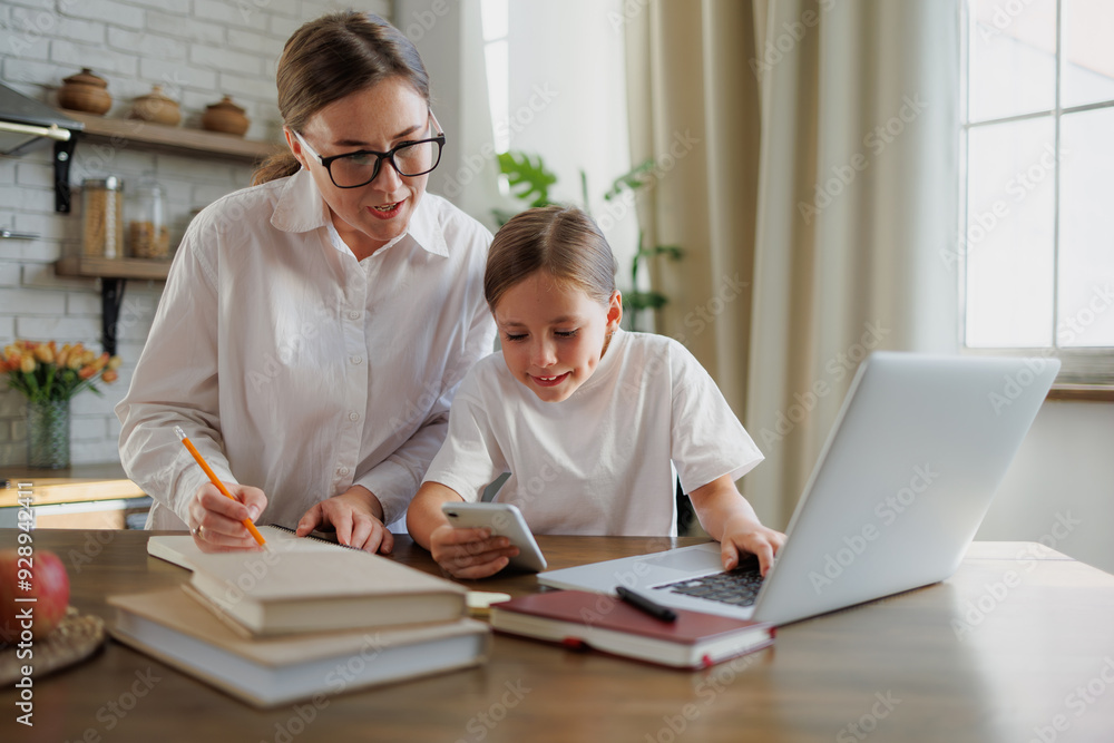Smiling family using devices during online education at home Smiling family using devices during online education at home