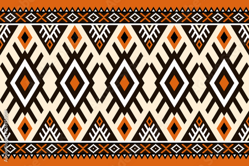 Vibrant ethnic pattern featuring geometric shapes in orange, black, and cream. Symmetrical ethnic design with diamond motifs and zigzag lines. Ideal for contemporary ethnic-inspired backgrounds.