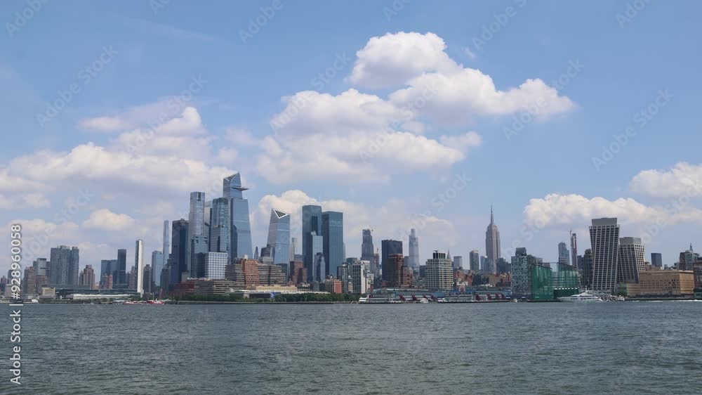 nyc skyline timelapse on hudson river with tall manhattan skyscrapers (moving clouds storm weather) dark daytime light (midtown view)