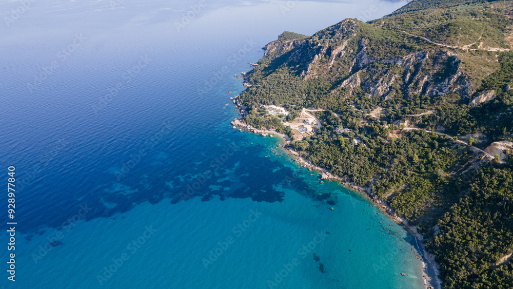 Aerial view of expensive residential houses in island small town Syvota Greece. American dream homes as example of real estate development in US suburbs Aerial view of expensive residential houses in island small town Syvota Greece. American dream homes as example of real estate development in US suburbs