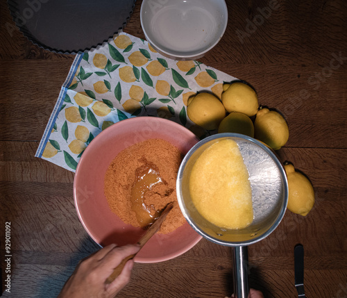 Chesese cake  base micxing  crushed  biscuits and  butter  photo